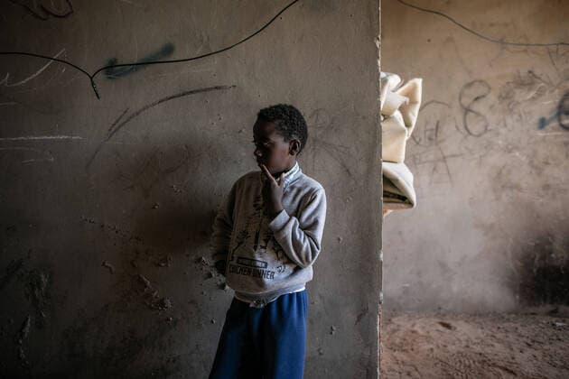 (200410) -- TRIPOLI, April 10, 2020 -- A displaced boy is seen in a building complex under construction in Tripoli, Libya, on April 10, 2020. The UN Support Mission in Libya (UNSMIL) has documented at least 356 civilian deaths and 329 injuries since the outbreak of a conflict in April 2019 between the eastern-based army and the UN-backed government in and around Tripoli. Since the beginning of the conflict, nearly 150,000 people in and around Tripoli have been forced to flee their homes, with 345,000 civilians remaining in frontline areas and some 749,000 living in conflict-affected areas, according to UNSMIL. (Photo by Xinhua) LIBYA-TRIPOLI-DISPLACED PEOPLE AmruxSalahuddien