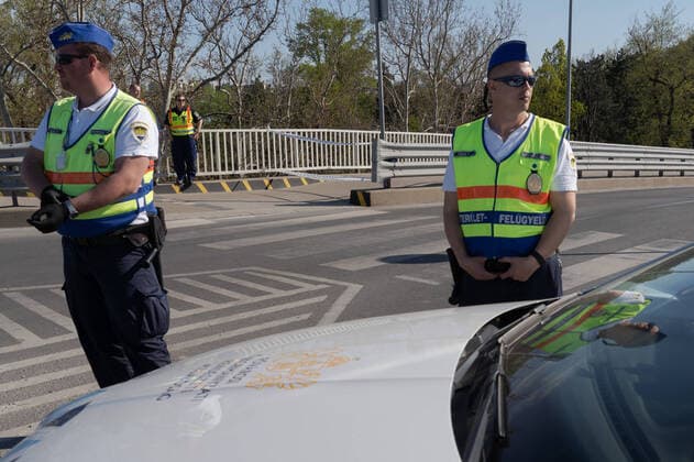 (200411) -- BUDAPEST, April 11, 2020 -- Police stand guard an entrance to a public park to be closed on the Easter weekend due to the COVID-19 pandemic in Budapest, Hungary, on April 10, 2020. (Photo by Xinhua) HUNGARY-BUDAPEST-COVID-19-PARK CLOSURE AttilaxVolgyi 