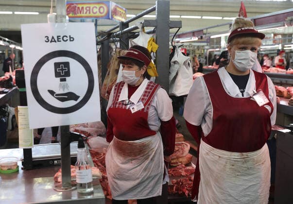 NOVOSIBIRSK, RUSSIA - APRIL 11, 2020: Meat for sale at the Oktyabrsky food market. Russian President Vladimir Putin has expanded non-working period till April 30, 2020 to prevent the spread of the novel coronavirus. A sign reads Here and urges to sanitize hands. Kirill Kukhmar TASS  TS0D5488