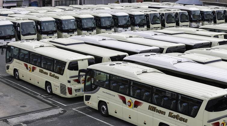 New coronavirus Photo taken in Higashiosaka, Osaka Prefecture, western Japan, on April 11, 2020, shows tour buses at a depot, which have been stranded since mid-March as people have shunned bus tours amid a surge in coronavirus infections. 