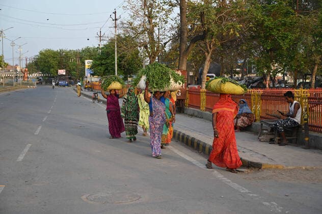 April 11, 2020, Prayagraj, Uttar Pradesh, India: Prayagraj: Women carry grass for their cattle during a government-imposed nationwide lockdown as a preventive measure against the COVID-19 coronavirus, in Allahabad on Saturday, April 11,2020. Prayagraj India - ZUMAv115 20200411_zap_v115_021 Copyright: xPrabhatxKumarxVermax