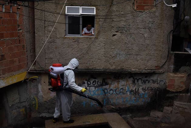 April 10, 2020: April 11.., 2020, Rio De Janeiro - ......Residents of the Santa Marta favela, in Botafogo, in the South Zone of Rio, start this Friday (10) to work on cleaning the areas of the community on their own. The objective is to prevent the lack of sanitary conditions from facilitating the expansion of the Covid-19 region. volunteers start the process with personal protective equipment (PPE). The Botafogo neighborhood, where the Santa Marta slum is located, had 36 confirmed cases of the new coronavirus as of this Sunday, according to the State Health Secretariat Panel. In the municipality of Rio alone, 1068 cases were recorded, according to the same panel. Cases across the state totaled 1394 cases..on April 10, 2020. - ZUMAt142 20200410_zap_t142_014 Copyright: xFabioxTeixeirax