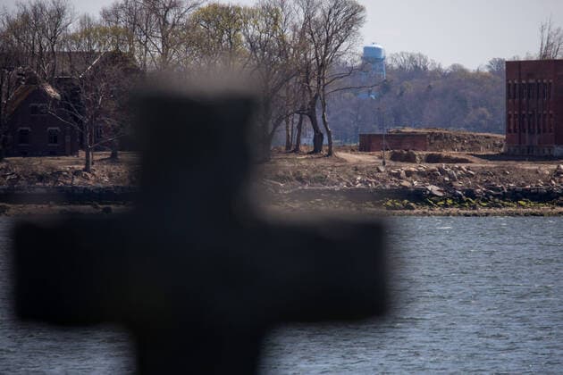 (200411) -- NEW YORK, April 11, 2020 -- A large burial pit and abandoned buildings are seen on Hart Island where some of the COVID-19 victims are buried, in New York, the United States, April 11, 2020. The death toll from COVID-19 in the United States surpassed that in Italy on Saturday, reaching 19,701 as of 1: 35 p.m. (1735 GMT) among 506,188 cases, according to data compiled by Johns Hopkins University. (Photo by Michael Nagle Xinhua) U.S.-NEW YORK-COVID-19-DEATH TOLL WangxYing 