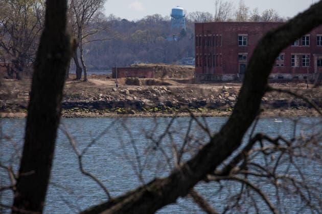(200411) -- NEW YORK, April 11, 2020 -- A large burial pit and abandoned buildings are seen on Hart Island where some of the COVID-19 victims are buried, in New York, the United States, April 11, 2020. The death toll from COVID-19 in the United States surpassed that in Italy on Saturday, reaching 19,701 as of 1: 35 p.m. (1735 GMT) among 506,188 cases, according to data compiled by Johns Hopkins University. (Photo by Michael Nagle Xinhua) U.S.-NEW YORK-COVID-19-DEATH TOLL WangxYing 