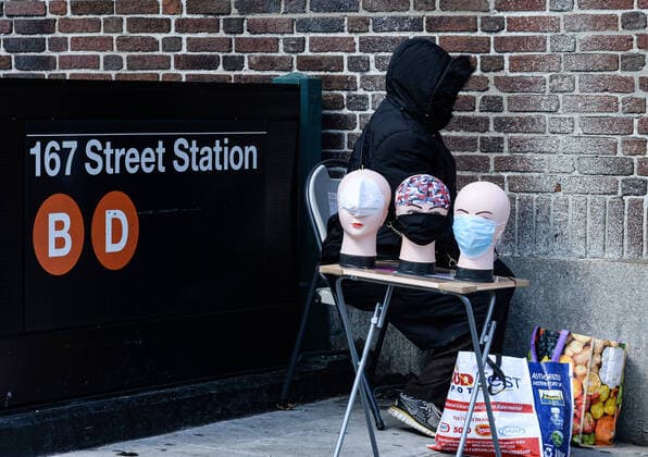 April 11, 2020, New York Bronx, USA: Woman selling masks on the corner !67 St bronx . The Bronx heavily minority borough has the highest per-case fatality rate in NYC. The COVID-19 death toll in the NYC is 7,844 and 170,512 confirmed cases. 04 11 20. New York Bronx. New York Bronx. USA - ZUMAs252 20200411_znp_s252_004 Copyright: xMarcusxSantosx