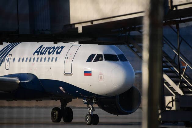 VLADIVOSTOK, RUSSIA - APRIL 12, 2020: A plane of the Aurora Russian Far East air carrier, subsidiary of Aeroflot - Russian Airlines, that has brought Russian citizens from Seoul, at Vladivostok International Airport. Russia has suspended all international flights from March 27, 2020 due to the COVID-19 infection threat. Airlines are allowed to fly to other countries to evacuate Russian citizens. Yuri Smityuk TASS  TS0D567F