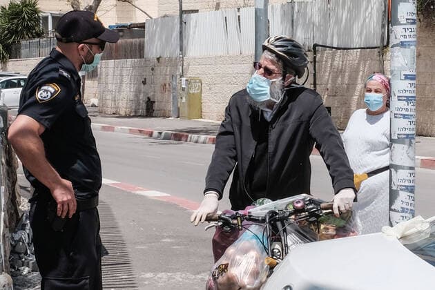 April 12, 2020, Jerusalem, Israel: The Israel Police, reinforced by IDF soldiers, enforces a newly imposed full closure on Har Nof neighborhood, one of 17 predominantly Jewish religious neighborhoods in Jerusalem, with increased coronavirus infections. The number of confirmed COVID-19 cases in Israel rises to 10,878, with 103 deaths. Jerusalem Israel - ZUMAa126 20200412_zap_a126_007 Copyright: xNirxAlonx