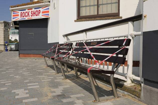 (200412) -- BOURNEMOUTH, April 12, 2020 (Xinhua) -- Benches are taped to prevent people from sitting on Bournemouth Beach in Bournemouth, Britain on April 11, 2020. (Photo by Tim Ireland Xinhua) BRITAIN-BOURNEMOUTH-COVID-19-BEACH 