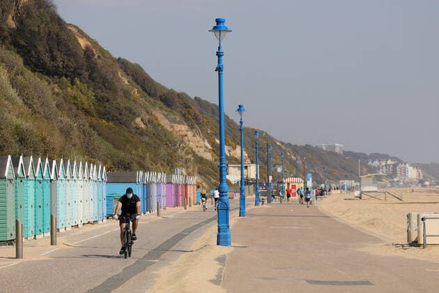 (200412) -- BOURNEMOUTH, April 12, 2020 (Xinhua) -- A person cycles on Bournemouth Beach in Bournemouth, Britain on April 11, 2020. (Photo by Tim Ireland Xinhua) BRITAIN-BOURNEMOUTH-COVID-19-BEACH 