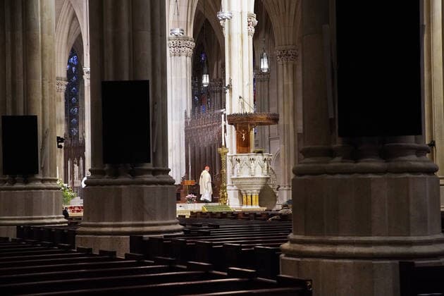 Church pews are empty of parishioners due to the Coronavirus pandemic while Cardinal Timothy Dolan offers Easter Sunday Mass at St. Patrick s Cathedral in New York City on Sunday, April 12, 2020. For the first time, the United States government and President Trump have declared all 50 states a major disaster for the same event.  NYP20200412108 JOHNxANGELILLO