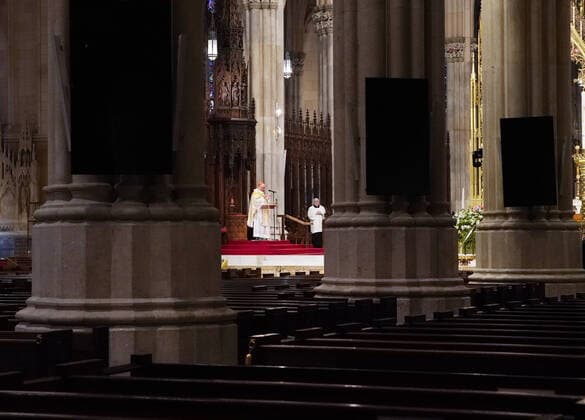 Church pews are empty of parishioners due to the Coronavirus pandemic while Cardinal Timothy Dolan offers Easter Sunday Mass at St. Patrick s Cathedral in New York City on Sunday, April 12, 2020. For the first time, the United States government and President Trump have declared all 50 states a major disaster for the same event.  NYP20200412111 JOHNxANGELILLO