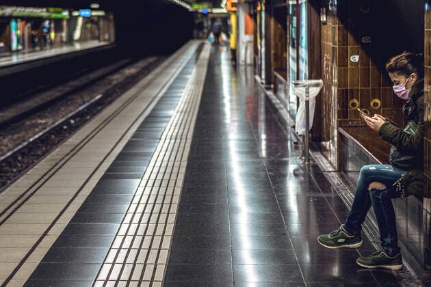 April 12, 2020: A commuter wearing a protective mask waits for the metro at the evening of Easter Sunday after one month of a nationwide lockdown due to the continuous spread of the virus. Spain registered again over 300 fatalities summing up to nearly 17000 in total. - ZUMAo105 20200412_zap_o105_009 Copyright: xMatthiasxOesterlex
