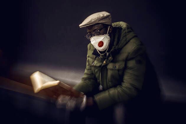 April 12, 2020: A commuter wearing a protective mask waits for the metro at the evening of Easter Sunday after one month of a nationwide lockdown due to the continuous spread of the virus. Spain registered again over 300 fatalities summing up to nearly 17000 in total. - ZUMAo105 20200412_zap_o105_012 Copyright: xMatthiasxOesterlex