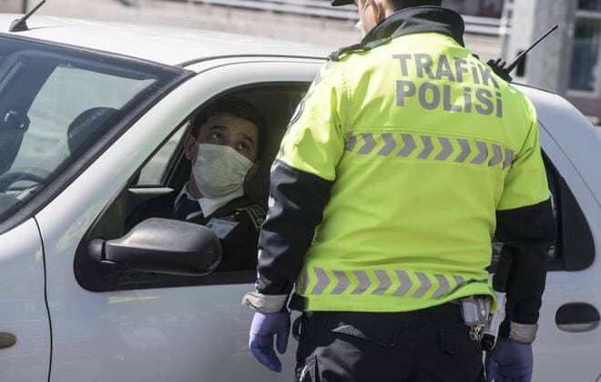 A police officer check traffic on the empty Kizilay Square in Ankara, on April 12, 2020, during the 48-hour curfew imposed by the government to stem the spread of the novel coronavirus (COVID-19). Turkey has confirmed 1,198 deaths and 56,956 positive cases of the coronavirus infection in the country. ( Copyright: AbdurrahmanxAntakyalix-xDepoxPho 16718767