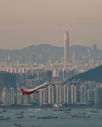 April 12, 2020, Hong Kong, China: An aircraft takes off at the Hong Kong International Airport pass the background of Shenzhen and empty vessel. Airlines across the globe have cancelled flights, postponed or adjusted their services in response to the coronavirus outbreak. Hong Kong China  - ZUMA 20200412_mda_j323_038 Copyright: xMayxJamesx