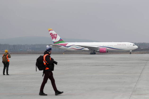 YEKATERINBURG, RUSSIA - APRIL 13, 2020: A Sunday Airlines plane carrying humanitarian aid arrives at Koltsovo International Airport. The first of the four humanitarian shipments to Russia s Ural Federal District, the charter flight from Shanghai has brought around $5m worth of medical supplies, such as non-reusable and high-level protection masks, face shields, protective goggles and suits, antiseptics and touch-free thermometers, over 10,6m items totaling more than 100t in weight. Equally divided between the Sverdlovsk and Chelyabinsk Regions, it will be sent to healthcare, budgetary, charitable institutions and volunteer organisations. Donat Sorokin TASS TS0D57EB