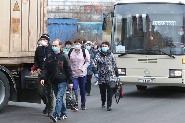 MOSCOW, RUSSIA - APRIL 13, 2020: Staff members of the Meridian fish and seafood company travel to work by shuttle during the lockdown; the Russian government has extended the period off work with full pay until April 30 nationwide to counter the spread of the COVID-19 infection. Vladimir Gerdo TASS  TS0D58E0