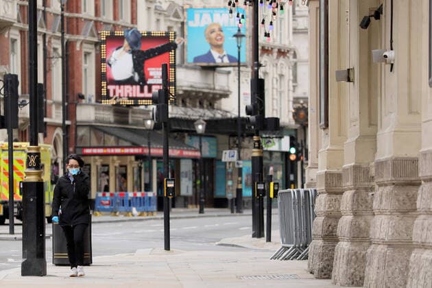 (200413) -- LONDON, April 13, 2020 (Xinhua) -- A person wearing a mask walks down Shaftesbury Avenue in London, Britain, April 13, 2020. The death toll of those hospitalized in Britain who tested positive for the novel coronavirus reached 10,612 as of Saturday afternoon, the Department of Health and Social Care said Sunday. (Photo by Tim Ireland Xinhua) BRITAIN-LONDON-COVID-19-DEATH TOLL 