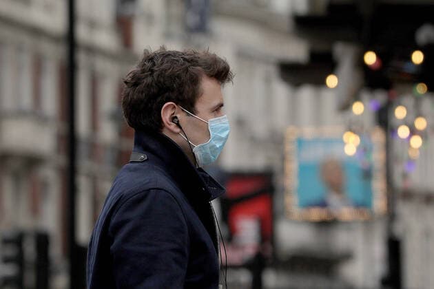 (200413) -- LONDON, April 13, 2020 (Xinhua) -- A man wearing a mask walks down Shaftesbury Avenue in London, Britain, April 13, 2020. The death toll of those hospitalized in Britain who tested positive for the novel coronavirus reached 10,612 as of Saturday afternoon, the Department of Health and Social Care said Sunday. (Photo by Tim Ireland Xinhua) BRITAIN-LONDON-COVID-19-DEATH TOLL 