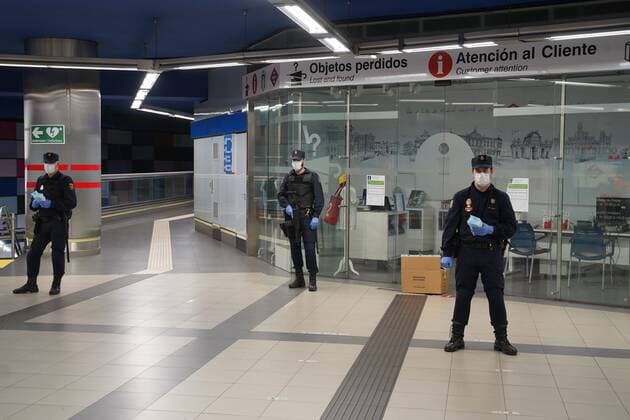 A police officer gives out free protective face masks during the lockdown amid the coronavirus disease COVID 19 outbreak in Madrid, Spain, April 13, 2020 Cordon Press