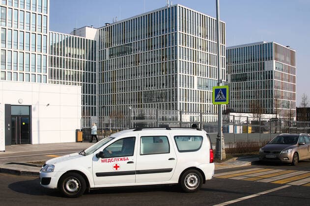 MOSCOW, RUSSIA - APRIL 13, 2020: A medical service vehicle at the Novomoskovsky multipurpose medical center for patients with suspected COVID-19 coronavirus infection. Valery Sharifulin TASS  TS0D5931