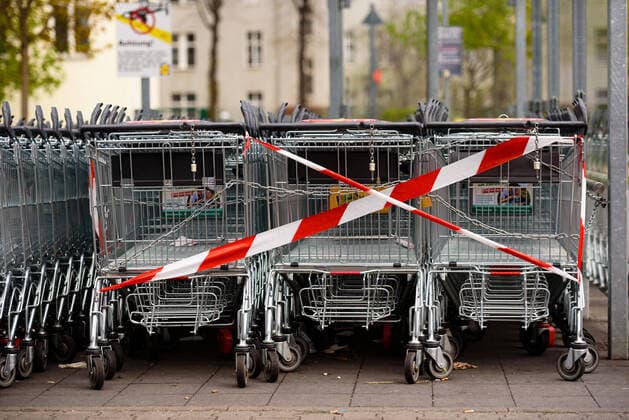 April 13, 2020: Shopping carts on a parking lot in front of a shopping mall in Berlin are blocked off to regulate the number of customers. The German government has considerably restricted public life over the last weeks in order to slow down the spread of the Covid 19 pandemic. - ZUMAs172 20200413_zap_s172_006 Copyright: xJanxScheunertx