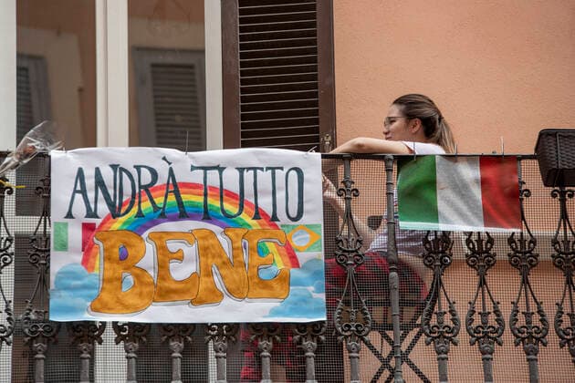 Coronavirus emergency in Rome A girl in a balcony in via del Corso. Empty streets in the city centre during Coronavirus (Covid-19) emergency in Rome. Rome Italy Italy Copyright: DavidexFracassi