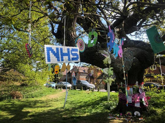 A tree is decorated by local residents in a village with positive messages and thank you to the NHS during Easter bank holiday Monday during the Covid-19 Pandemic as the UK Government advice to maintain social distancing and minimise time outside in High Wycombe on 13 April 2020. Copyright: xAndyxRowlandx PMI-3461-0017