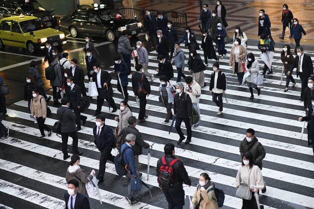 OSAKA, JAPAN - APRIL 13: Commuters wearing mask head home near JR Osaka Station on Monday, April 13, 2020, amid the spread of the new coronavirus. Japanese Prime Minister Shinzo Abe declared a state of emergency last Tuesday for Tokyo and six other prefectures to ramp up defenses against the spread of the coronavirus. (Photo: Richard Atrero de Guzman AFLO)  (125302524)