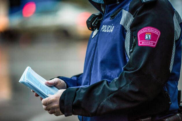 April 13, 2020, Madrid, Spain: A police officer holds face masks that are to be distributed at Cibeles Square in Madrid..Some companies were set to resume operations at the end of the two-week halt of all non-essential activities amid a national lockdown to stop the spread of the COVID-19 coronavirus. More than 15,000 people are reported to have died in Spain due to the COVID-19 outbreak, although the country has reported a decline in the daily number of deaths. Madrid Spain - ZUMAs197 20200413_zaa_s197_062 Copyright: xBraisxG.xRoucox