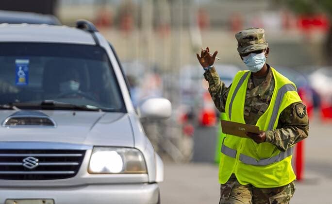 April 13, 2020, Miami, Fl, USA: A COVID-19 drive-thru testing center operates in a parking lot near the Hard Rock Stadium in Miami Gardens, Florida on Monday, April 13, 2020. The Florida Army National Guard set up the center and is now expanding its testing criteria to include anyone with COVID-19 symptoms. Miami USA - ZUMAm67_ 20200413_zaf_m67_023 Copyright: xMatiasxJ.xOcnerx