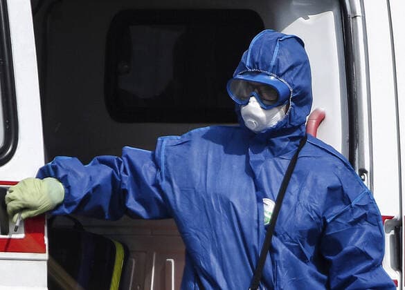 MOSCOW, RUSSIA - APRIL 13, 2020: An ambulance crew member in a protective suit is seen at the Novomoskovsky multipurpose medical centre in Novomoskovsky Administrative District of Moscow, where patients with confirmed or suspected novel coronavirus infection (COVID-19) are being treated. As of 13 April 2020, Russia has reported more 18,300 confirmed cases of the novel coronavirus infection, with more than 11,500 confirmed cases in Moscow. Valery Sharifulin TASS  TS0D594C