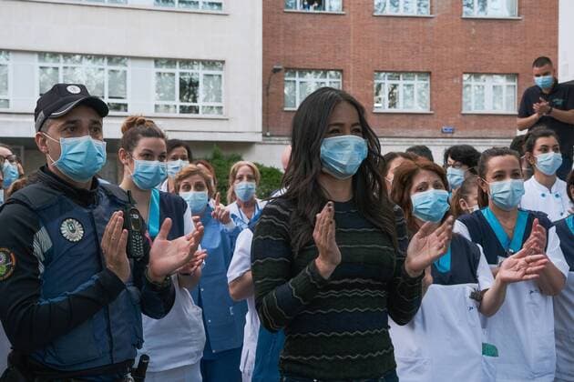 Begona Villacis of the Fundacion Jimenez Diaz Hospital gestures as neighbours applaud from their balconies in support of healthcare workers, during the coronavirus disease COVID 19 outbreak in Madrid, Spain April 13, 2020 Cordon Press