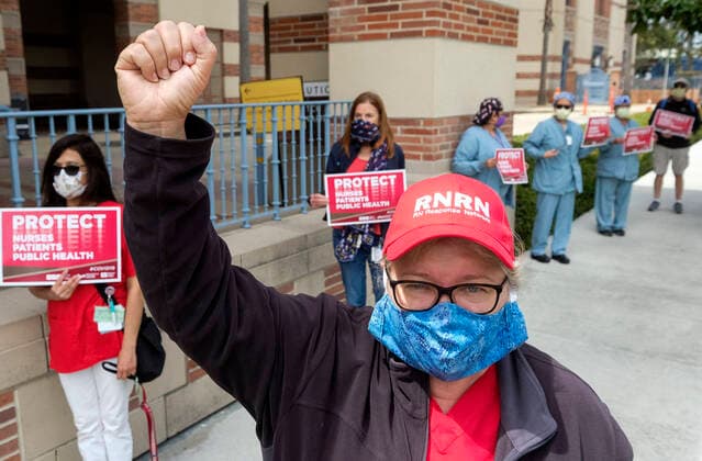 April 13, 2020, Los Angeles, California, U.S: Nurses and healthcare workers in a protest for the lack of personal protective equipment at UCLA Medical Center in Santa Monica, California, Monday April 13, 2020. Los Angeles U.S. - ZUMAc68_ 20200413_zaf_c68_003 Copyright: xRingoxChiux