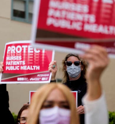 April 13, 2020, Los Angeles, California, U.S: A nurse joins other nurses and healthcare workers in a protest for the lack of personal protective equipment at UCLA Medical Center in Santa Monica, California, Monday April 13, 2020. Los Angeles U.S. - ZUMAc68_ 20200413_zaf_c68_019 Copyright: xRingoxChiux