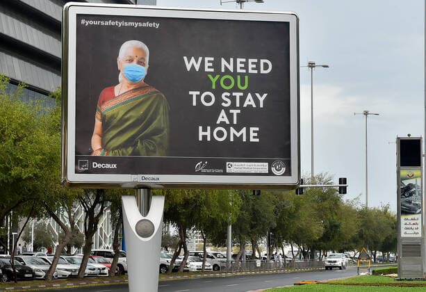 (200414) -- DOHA, April 14, 2020 (Xinhua) -- A COVID-19 awareness billboard is seen by the street in Doha, capital of Qatar, April 13, 2020. (Photo by Nikku Xinhua) QATAR-DOHA-COVID-19 