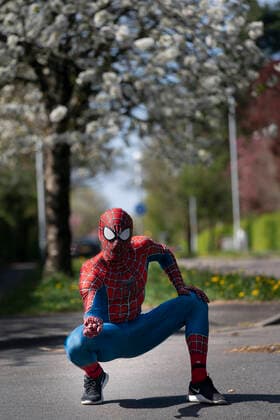 (200414) -- MANCHESTER, April 14, 2020 (Xinhua) -- Jason Baird, who runs a martial arts academy in South Manchester, dressed up as Spider-Man, entertains the public amid the COVID-19 outbreak in Manchester, Britain on April 13, 2020. (Photo by Jon Super Xinhua) BRITAIN-MANCHESTER-COVID-19-SPIDER-MAN 
