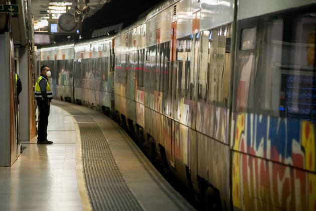 April 14, 2020, Barcelona, Catalonia, Spain: A security guard wearing a protective face mask stands on the platform of Catalunya station in Barcelona. Thousands of people are returning to work after the Spanish government has lift the strictest measures of coronavirus confinement. Barcelona Spain - ZUMAb137 20200414_zap_b137_013 Copyright: xJordixBoixareux