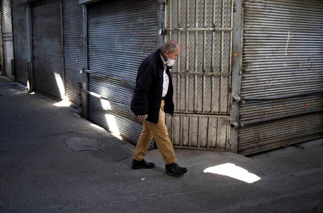 (200414) -- TEHRAN, April 14, 2020 -- A man walks past closed shops at the Grand Bazaar in Tehran, Iran, on April 13, 2020. (Photo by Xinhua) IRAN-TEHRAN-COVID-19-GRAND BAZAAR AhmadxHalabisaz 