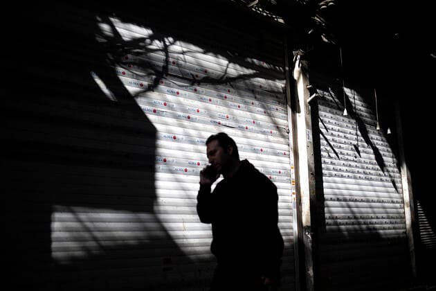 (200414) -- TEHRAN, April 14, 2020 -- A man walks past closed shops at the Grand Bazaar in Tehran, Iran, on April 13, 2020. (Photo by Xinhua) IRAN-TEHRAN-COVID-19-GRAND BAZAAR AhmadxHalabisaz 