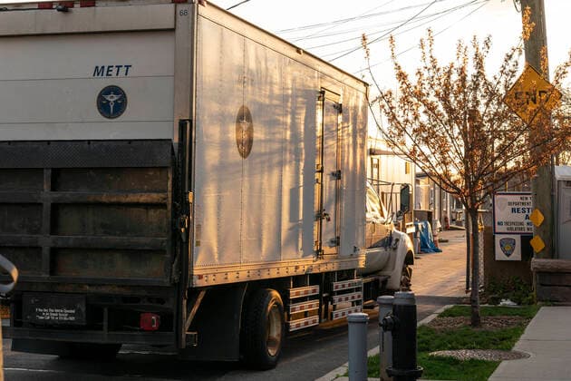 NYC buries unclaimed COVID-19 bodies on Hart Island Medical Examiner refrigerated truck loaded on ferry from City Island to Hart Island where unclaimed COVID-19 bodies are buried New York New York United States Copyright: LevxRadin