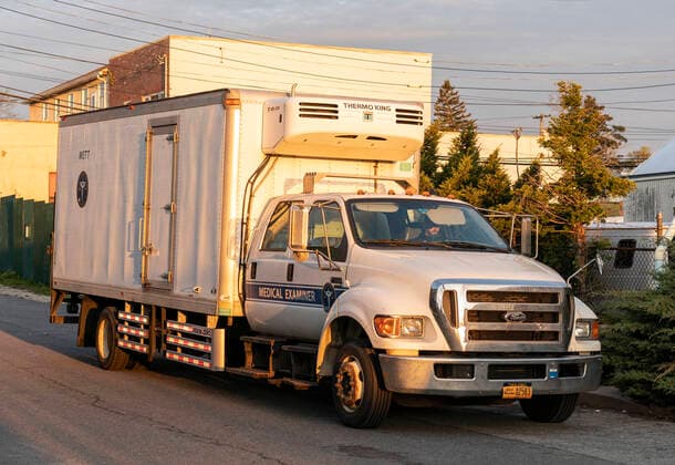 NYC buries unclaimed COVID-19 bodies on Hart Island Medical Examiner refrigerated truck seen before loaded on ferry from City Island to Hart Island where unclaimed COVID-19 bodies are buried New York New York United States Copyright: LevxRadin
