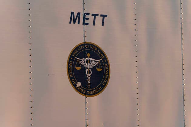 NYC buries unclaimed COVID-19 bodies on Hart Island Medical Examiner refrigerated truck seen before loaded on ferry from City Island to Hart Island where unclaimed COVID-19 bodies are buried New York New York United States Copyright: LevxRadin