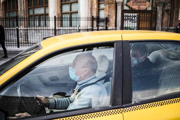 (200414) -- TEHRAN, April 14, 2020 -- A taxi driver wearing face mask drives his car on a street in Tehran, Iran, April 13, 2020. Iran registered 1,574 new COVID-19 cases over the past 24 hours, bringing the total number of confirmed cases to 74,877, according to Iran s health ministry on Tuesday. (Photo by Xinhua) IRAN-TEHRAN-COVID-19-CASES AhmadxHalabisaz 