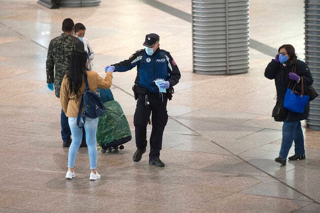 The Police of Madrid distributes masks at the Atocha station during the health crisis due to the Covid-19 virus pandemic - Coronaviruss. April 14,2020. (2020041423)