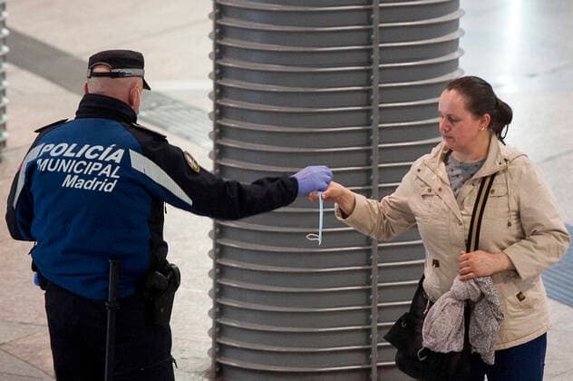 The Police of Madrid distributes masks at the Atocha station during the health crisis due to the Covid-19 virus pandemic - Coronaviruss. April 14,2020. (2020041425)