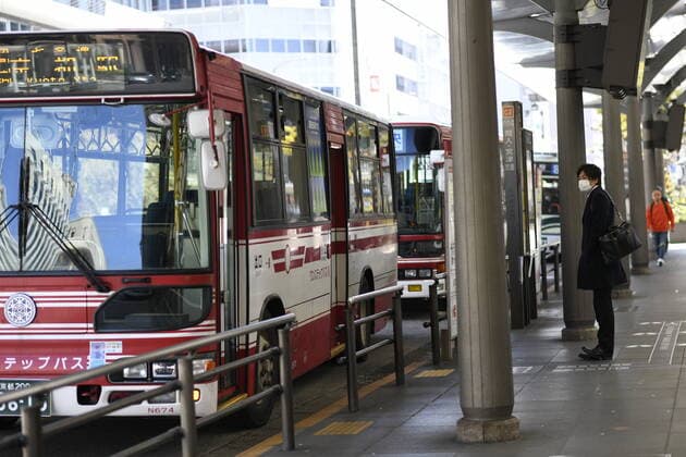 KYOTO, JAPAN - APRIL 14: Commuters wearing face mask waits the bus in front of JR Kyoto Station on Tuesday, April 14, 2020, amid the spread of the new coronavirus. Japanese Prime Minister Shinzo Abe declared a state of emergency last week for Tokyo and six other prefectures including Kyoto to ramp up defenses against the spread of the coronavirus. (Photo: Richard Atrero de Guzman AFLO)  (125334774)