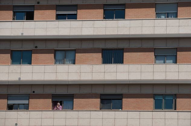 April 14, 2020, Malaga, Spain: A man on his balcony under confinement amid coronavirus outbreak..Spaniards get back to their jobs after finishing the standstill of all work activities and services not essential due to the alarm state caused by the outbreak of coronavirus disease (COVID-19) in Spain. Malaga Spain - ZUMAs197 20200414_zaa_s197_073 Copyright: xJesusxMeridax