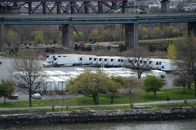 April 14, 2020, New York Manhattan, USA: 69 refrigerated trailers sat in a parking lot outside of Icahn Stadium on Randall s Island. The island has recently been transformed into a temporary morgue for the dead, as trenches are being dug on Hart Island in the NYC to store unclaimed bodies. Death toll in N.Y. 6,182 as confirmed cases 106,813 04 11 20. New York Manhattan Randalls Island Icahn Stadium New York Manhattan USA - ZUMAs252 20200414_znp_s252_008 Copyright: xMarcusxSantosx