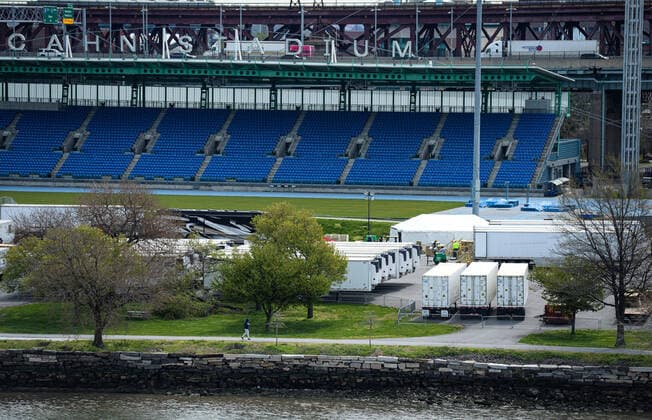 April 14, 2020, New York Manhattan, USA: 69 refrigerated trailers sat in a parking lot outside of Icahn Stadium on Randall s Island. The island has recently been transformed into a temporary morgue for the dead, as trenches are being dug on Hart Island in the NYC to store unclaimed bodies. Death toll in N.Y. 6,182 as confirmed cases 106,813 04 11 20. New York Manhattan Randalls Island Icahn Stadium New York Manhattan USA - ZUMAs252 20200414_znp_s252_010 Copyright: xMarcusxSantosx